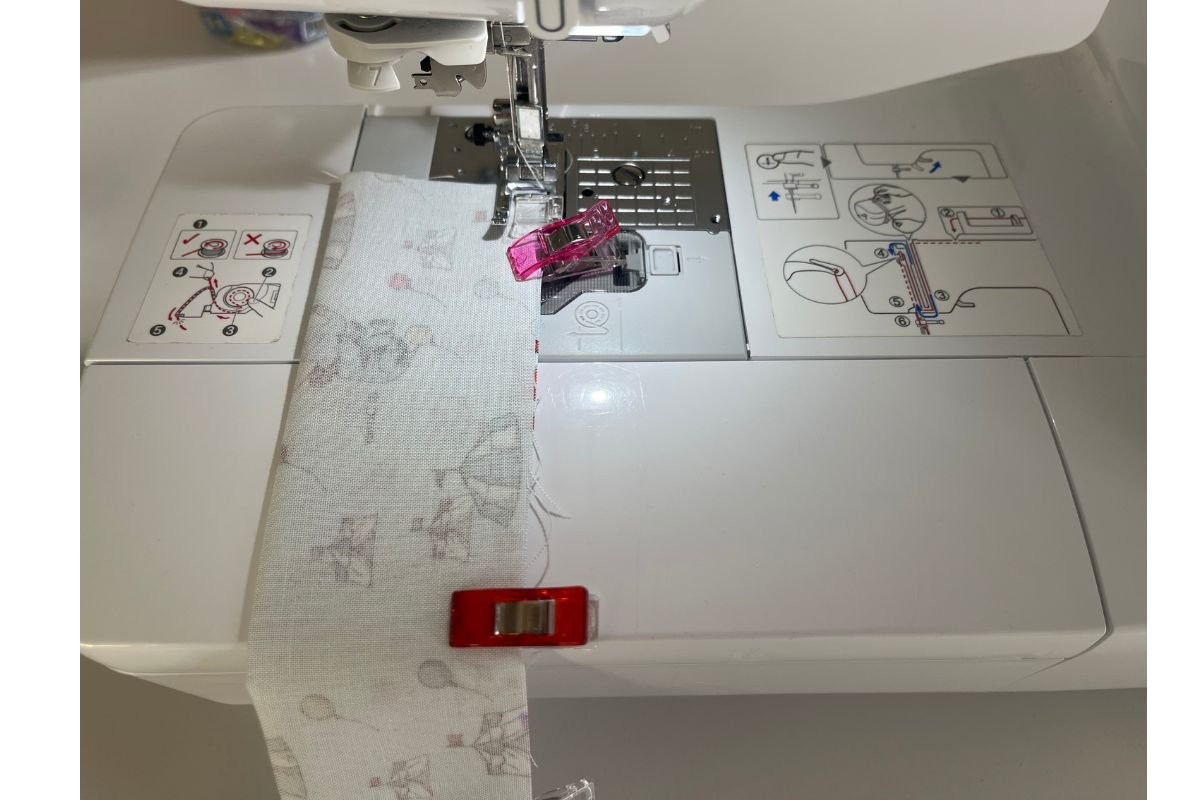 Sew the long edge of the fabric in straight line