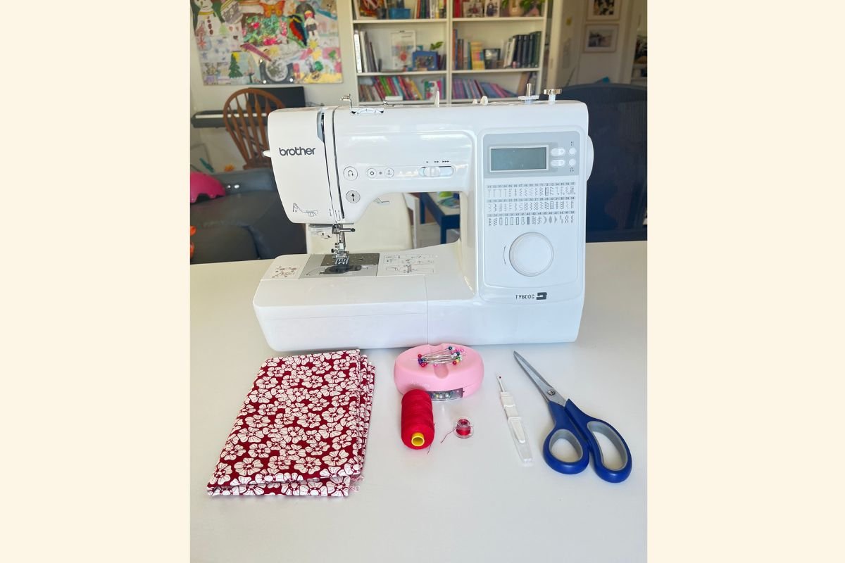 close up of brother machine, scissors, thread, seam ripper