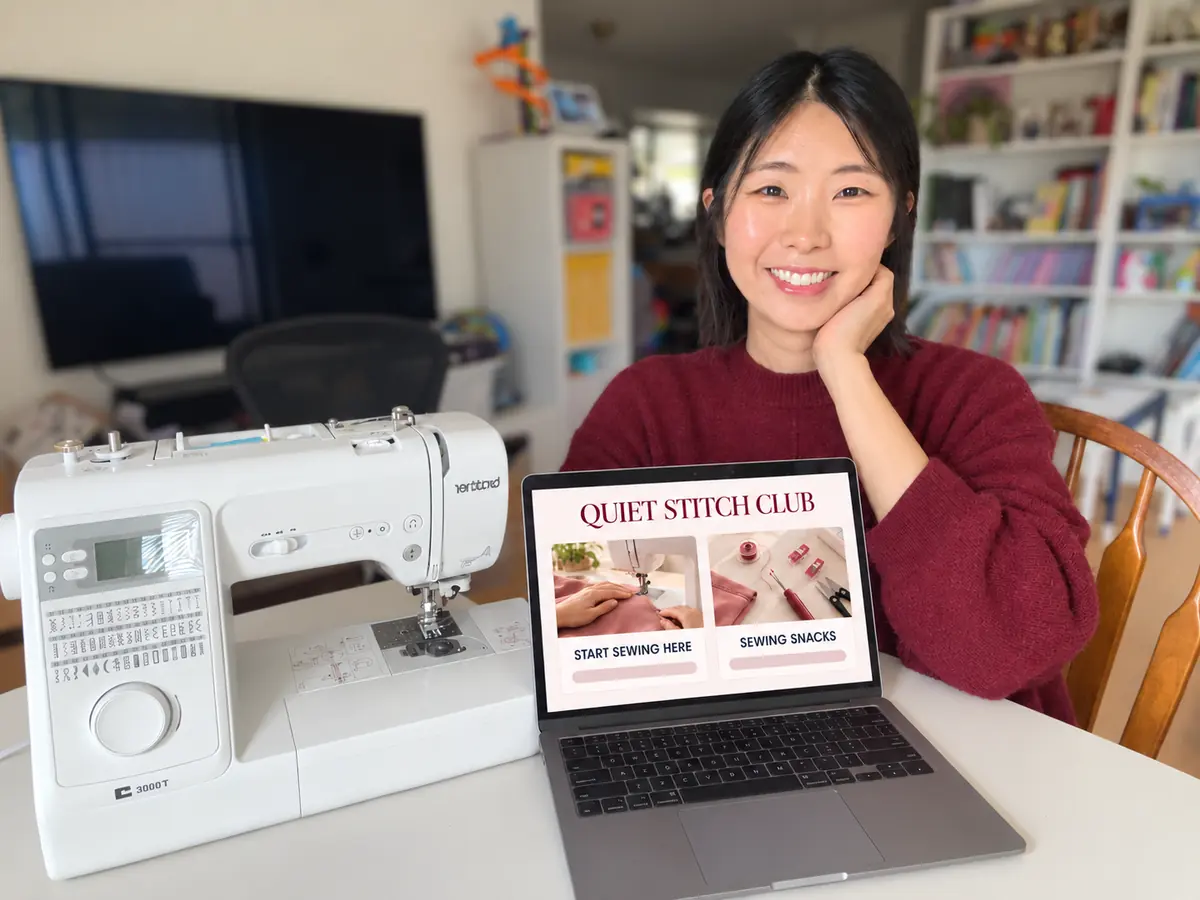 Sukhee from Sew for Max beside a sewing machine and the Quiet Stitch Club beginner sewing classroom